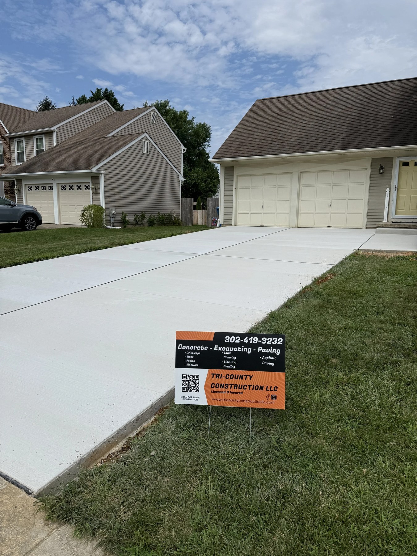 Newly poured concrete driveway in front of a residential home in New Castle County, DE
