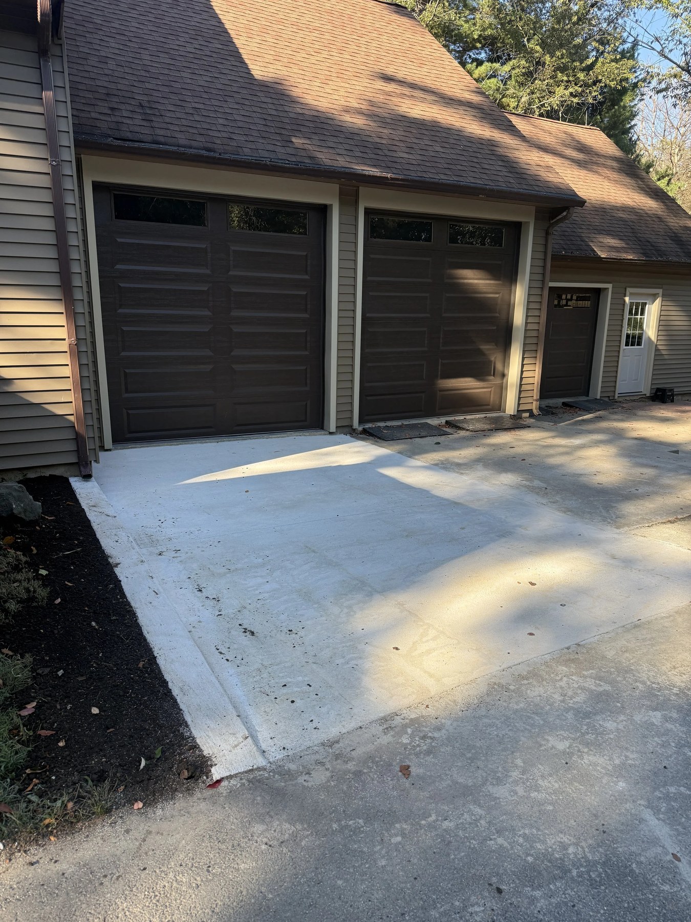 Commercial-grade concrete pour with two-bay garage access in New Castle County, DE