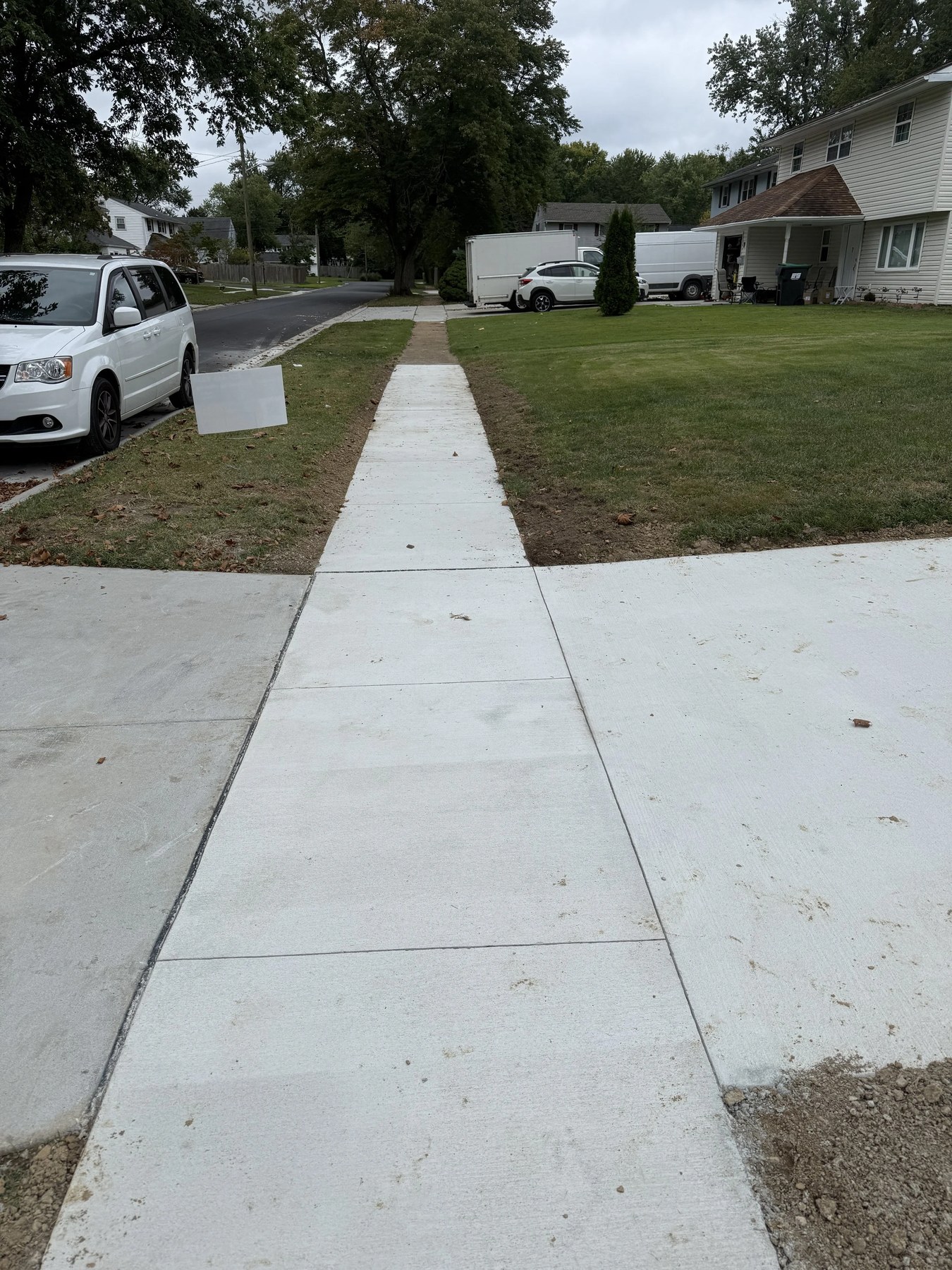New concrete sidewalk leading from house to street in New Castle County, DE